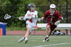 Alex Titto challenges an Albertus Magnus defender on May 3. Titto had five goals in Eastchester’s win.