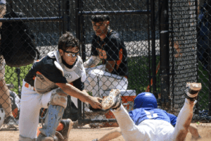 Jacob Liberati applies a tag at the plate on Saturday afternoon. Liberati took over for the injured James Galati in the first inning. Photos/Mike Smith