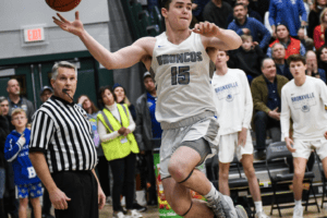 Conor O'Neill makes a play on a loose ball against Friends Academy on March 13, 2022. The Quakers topped the Broncos 50-46. Photo/Mike Smith